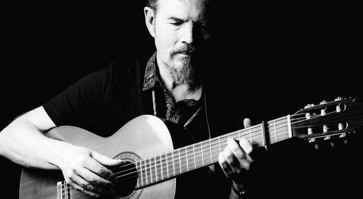 Keith James playing the guitar